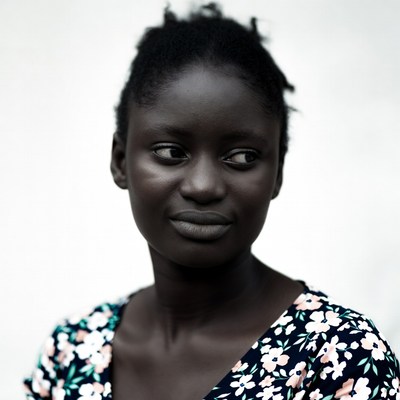 African woman in floral dress