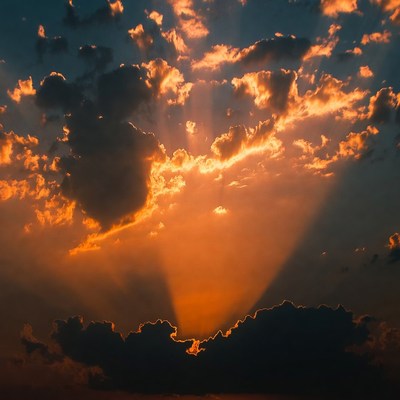 Dramatic Sun Rays Through Clouds