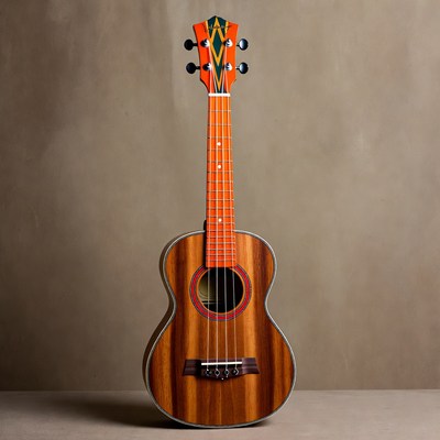 Orange KoAloha Ukulele on Tan Background