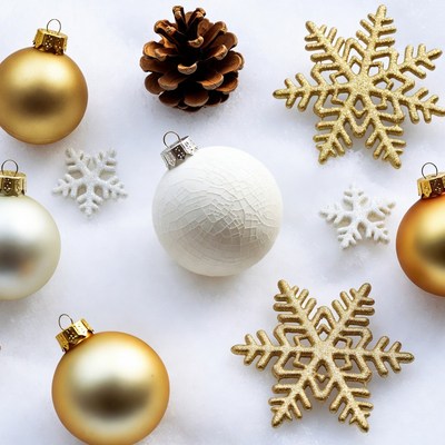 Gold and White Christmas Ornaments on Snow