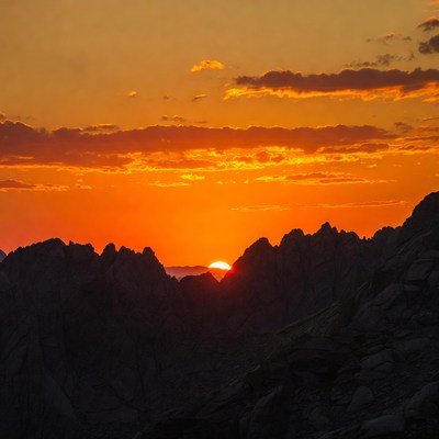 Sunset Behind Jagged Mountains