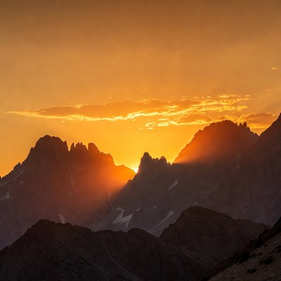 Sunset Behind Jagged Mountains