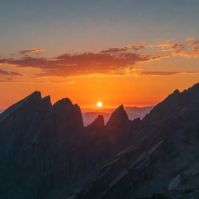Sunset Behind Jagged Mountains
