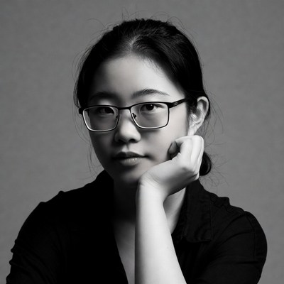 Asian woman with glasses thoughtful pose