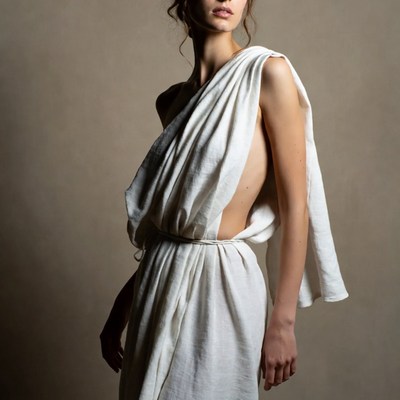 Woman in white draped toga