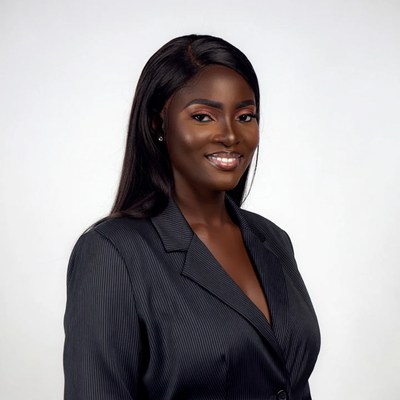 African woman in black suit smiling