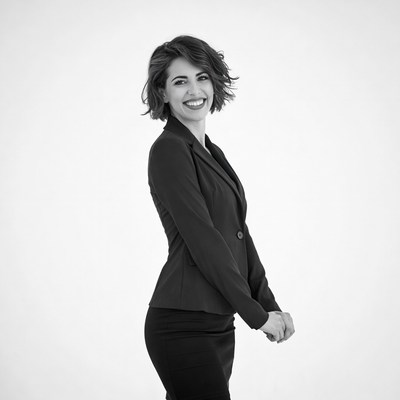 Smiling woman in black suit