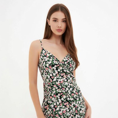 Woman in floral spaghetti strap dress