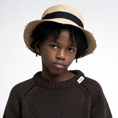 Black boy wearing straw hat