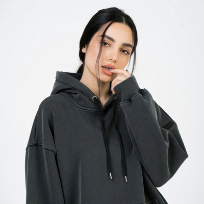Asian woman in gray hoodie