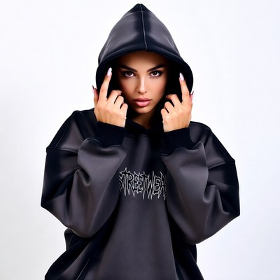 Woman in black streetwear hoodie