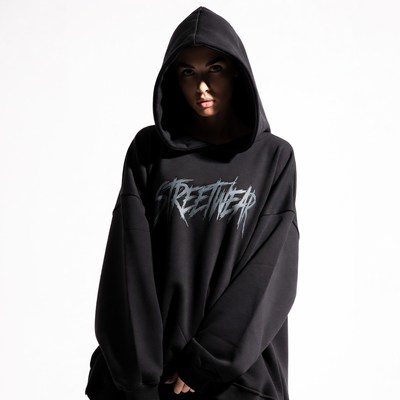 Woman in black oversized streetwear hoodie
