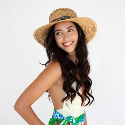 Smiling woman in straw hat and swimsuit