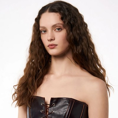 Woman in black corset top