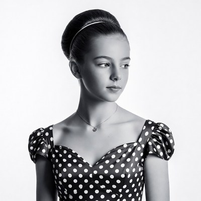 Girl in polka dot dress profile