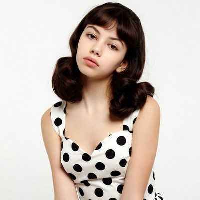 Girl in polka dot dress with bangs