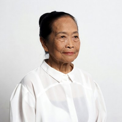 Elderly Asian woman in white blouse