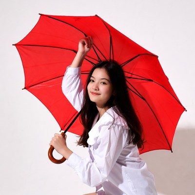 Asian woman holding red umbrella