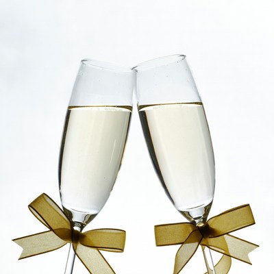 Two Champagne Glasses Clinking with Ribbons