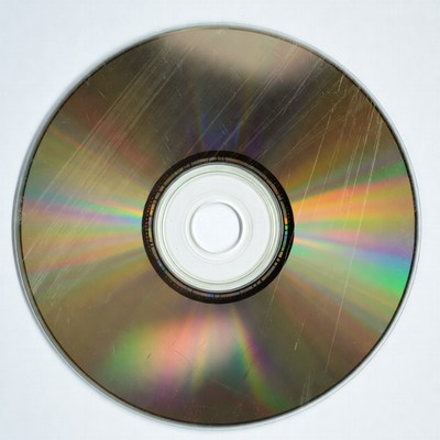 Scratched CD Disc on White Background