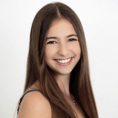 Smiling teenage girl with long brown hair