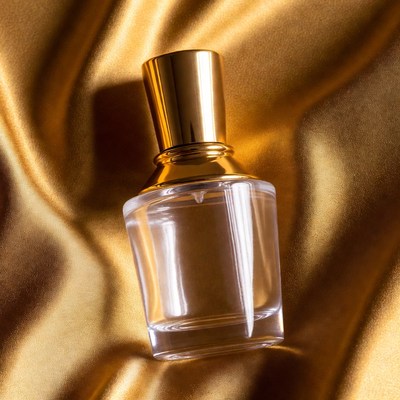 Perfume Bottle on Gold Fabric