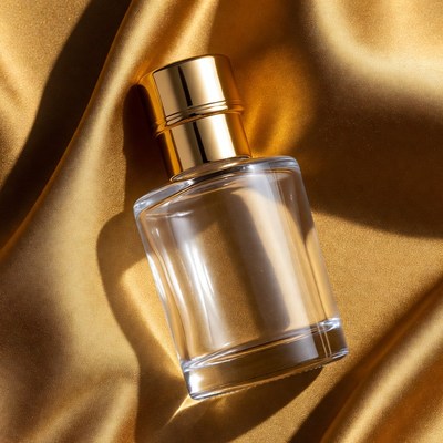 Perfume Bottle on Gold Fabric