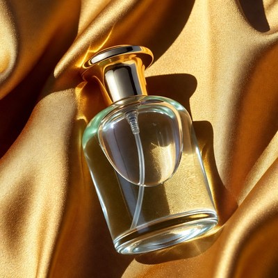 Perfume Bottle on Golden Fabric