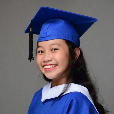 Asian girl in blue graduation gown