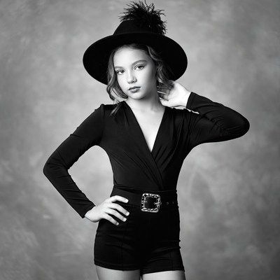 Girl in black hat and jumpsuit
