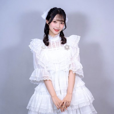 Asian woman in white lace lolita dress