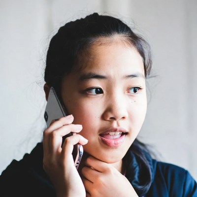 Asian girl talking on phone