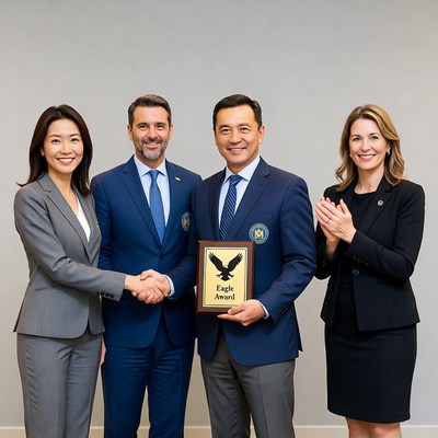 Group receiving Eagle Award trophy