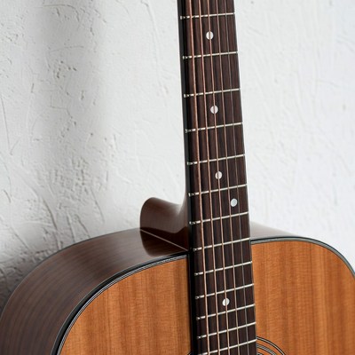 Acoustic Guitar on White Wall