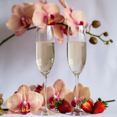 Two Champagne Glasses with Orchids Strawberries