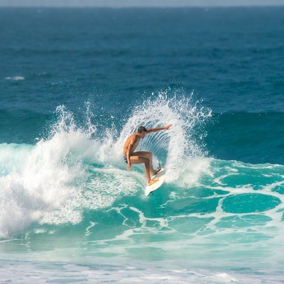 Man surfing on ocean wave
