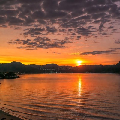 Sunset over lake with mountains