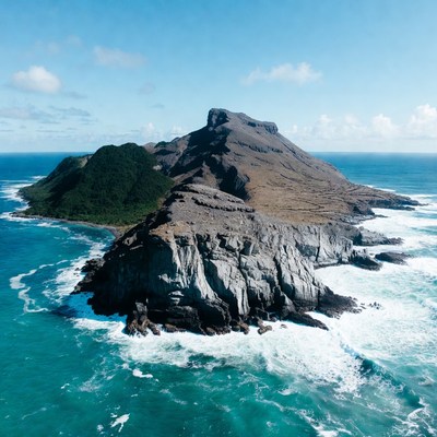 Island with mountain surrounded by ocean