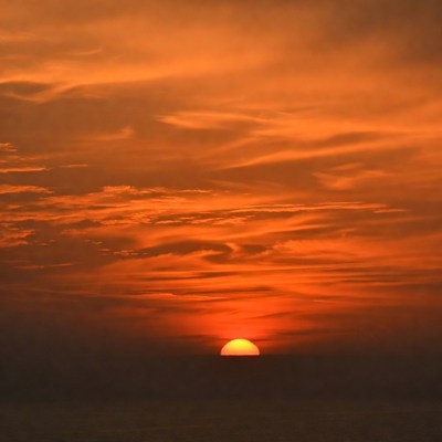 Sun Setting on Horizon