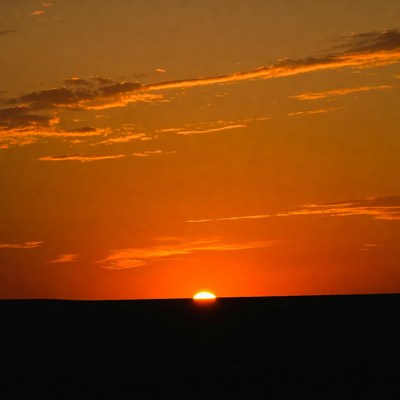 Sunset over flat horizon