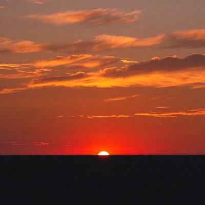 Sunset over ocean horizon