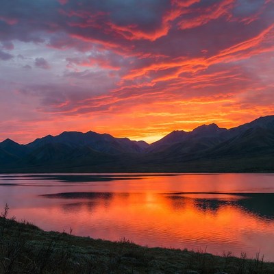 Sunset over mountains and lake