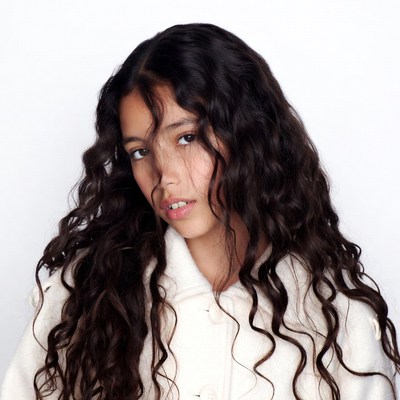 Young woman with curly black hair