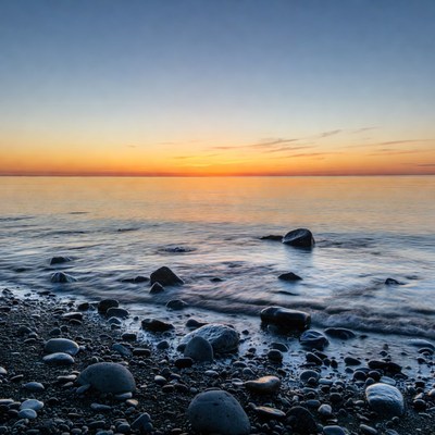 Sunset over rocky beach
