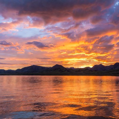 Sunset over mountains and lake