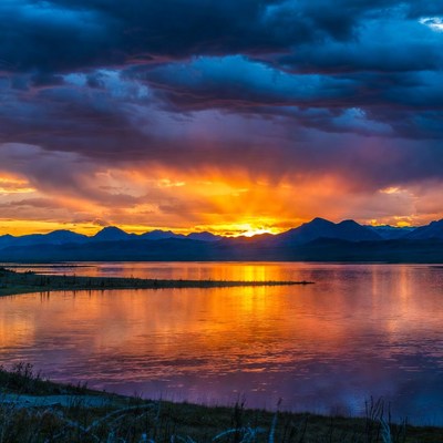 Sunset over mountains and lake