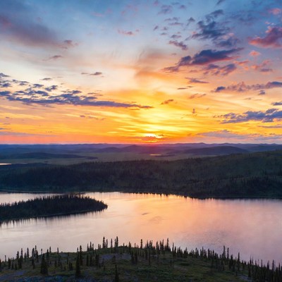 Sunset over lake and mountains