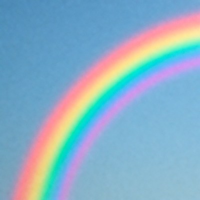 Vibrant Rainbow in Blue Sky