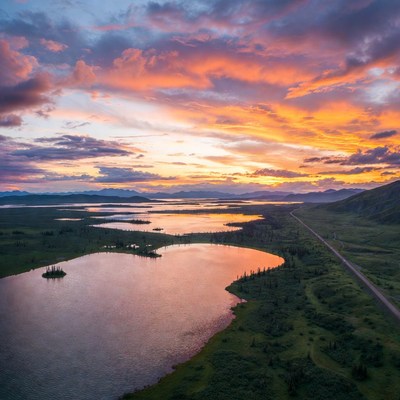 Sunset over mountain lakes and road