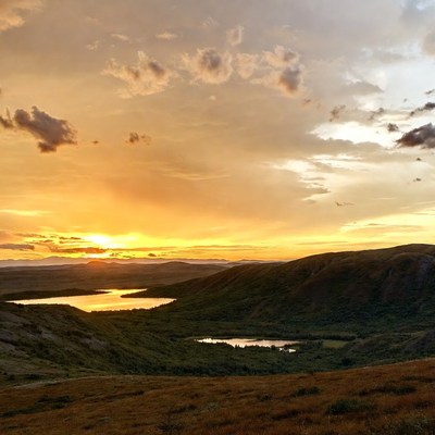 Sunset over mountain valley lake